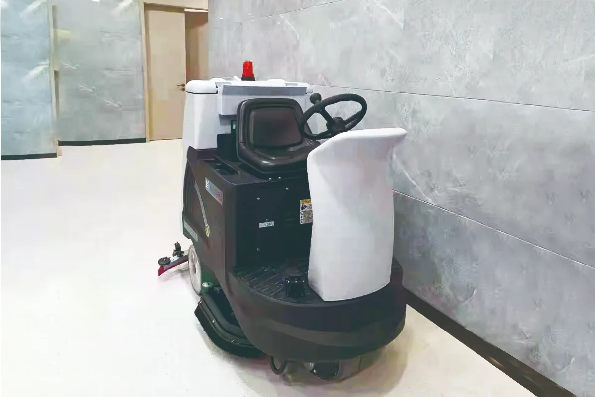 OLIFT ride-on floor scrubber and sweeper built for industrial warehouses